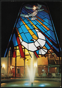 The stained glass window shows a dove. The symbol of the spirit of peace