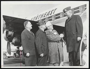 National Commander of American Legion Daniel F. Foley of Wabasha, Minn., is greeted at Boston Airport on his arrival for testimonial dinner tomorrow at Statler-Hilton Hotel. Welcoming Foley are, from left, National Committeeman Gabriel T. Olga, State Adjutant Peter E. Pappas and State Cmdr. Thomas Abbey