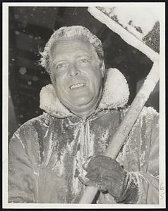 Man Behind The Scoop at South Station yesterday was James Murphy of Boston, who mustered a smile despite rigors of working in stormy yards.