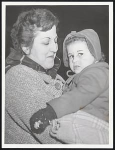 Passengers aboard the New Haven Railroad’s Merchants Limited arrive at South Station about nine hours late. Included are Mrs. Ethel Maunsell of Lynn with her son, Peter, 10, left and George, 12, upper left photo. At lower left are students from Endicott Junior College. They are, back grow, Barbara Schmermond and Susanne Chisholm. In front are Susan Collins and Hope Naylor. Mrs. Frank Kusela holds her daughter, Carol 3, above.