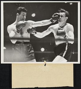 A Forecast of the Ending Fred Apostoli of San Francisco, claimant of the world middleweight title, sends a left jab kerplunk to the nose of Freddie Steele of Tacoma, middleweight champion, in the first round of their scheduled twelve-round non-title bout at Madison Square Garden Jan. 7, which went to the former in the 9th round by a knock out. The referee stopped the bout, which thrilled a crowd of 10,000.