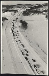 Stalled Cars help jam traffic on the northbound lane of Rte. 128 in Waltham. The Rte. 20 overpass can be seen in the distance.