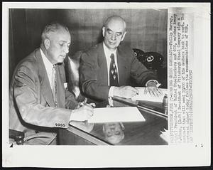 Pittsburgh, June 27-Signing Union Contract-- Phillip Murray (right) President of United Steelworkers and CIO, watches Avery C. Adams, (left) President of Pittsburgh Steel Company sign a contract that will send 10,500 of his members back to work. The contract signed today follows the recommendations of WSB.