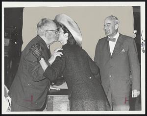 Toni, check out at the Russell School, Cambridge, as Mrs. Catherine Dillon watches. Wife of candidate Thomas Adams, center, gets kiss from Lincoln Town Clerk William H. Davis at Lincoln polling place as