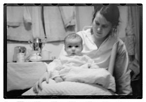 Maude Sanromá holding a baby on her lap