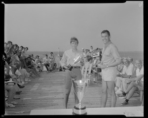 Bonnie MacSwan accepting awards at Barnstable Yacht Club from club commodore Tim Coggeshall, September 1955