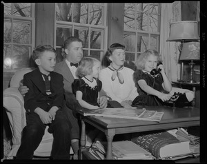 Allan F. Jones and family, Barnstable, trying out their new phone
