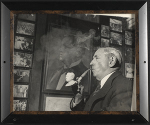 James Michael Curley smoking a pipe