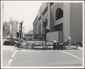 Construction of Boylston Building, Boston Public Library, laying brick at corner of Boylston Street and Exeter Street