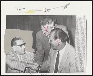 Change of Command for White Sox-- Ed Short, left, new general manager of the Chicago White Sox, is congratulated by Hank Greenberg, right, whom he succeeds. A.C. Allyn, center, principal owner of the club, announced the change in a press conference in Chicago today. Short, 42, had been traveling secretary of the club which he joined in 1950. Greenberg took over the general manager's job in June of this year when Bill Veeck resigned because of ill health. Greenberg said he quit for personal reasons.