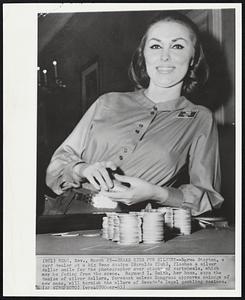 Snake Eyes for Silver?--Norma Stayton, a card dealer at a big Reno casino (Harolds Club), flashes a silver dollar smile for the photographer over stacks of cartwheels, which may be fading from the scene. Raymond I. Smith, her boss, says the demise of silver dollars, forecast unless Congress approves coinage of new ones, will tarnish the allure of Nevada’s legal gambling casinos.