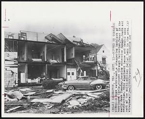 Ripped by Tornadic Winds--A huge waterspout, a staggering backlash of hurricane Carla, ripped through Galveston, Texas in the early dawn Tuesday, causing extensive damage, death and destruction. This apartment house and debris were part of the multi-million dollar loss to the area.
