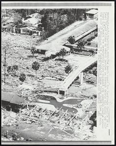 The death count for Hurricane Camille is at least 16, and climbs as search parties go through debris all along the Gulf Coast 8/16, where the devastating storm climaxed its powerful charge across the Gulf of Mexico. In the foreground, the Buena Vista Hotel lies in ruin.