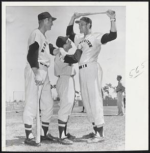 Former Red Sox Farmhand Albie Pearson, who stands 5:5 and is now an outfielder with the Senators is sandwiched between Jim Lemon (6.4), and Norm Zauchin (6.5) as they talk things over at the Senators' Clearwater, Fla. training camp. The Nats obtained Pearson and Zauchin from the Red Sox in deal for Pete Runnels.