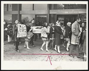 Picketers March in mock funeral cortege in front of the Kennedy Federal Building in protest of the government's cutting of funds for the Head Start program, an educational service for underprivileged children.