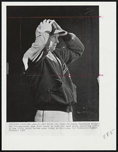 Red Holds His Head -- St. Louis Cardinals manager Red Schoendienst uses both hands to hold his head while observing action in the fifth World Series game today in St. Louis.