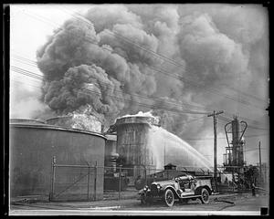 Firefighters using water hoses on an unidentified fire