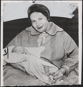 Delivers own baby while watching movie