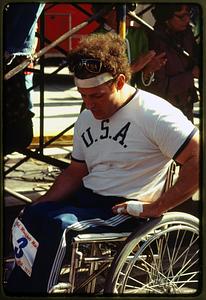 Boston 1977: A wheel chair marathoner rests after finishing the Boston Marathon