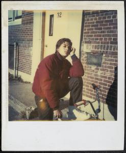 Young man posing on a bicycle