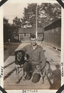 "Settles" with dogs "Terry and Nellie" U.S. Marine base Quantico, VA