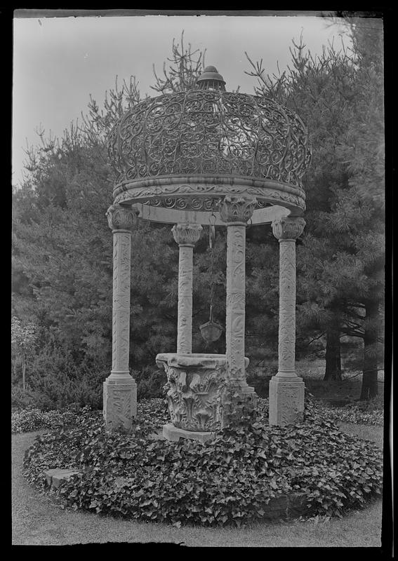 Old marble well-top in rose garden of Mrs. L. A. Frothingham