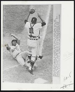 T. Davis Slides Under To Score--Tommy Davis, Los Angeles Dodgers outfielder, slides in to score from first base on Ron Fairly's hit to left center field in game with the Detroit Tigers in Lakeland today. Bill Freehan, Tiger catcher, jumps to take the relay throw from shortstop Dick McAuliffe as Davis slides in. Los Angeles won game 6-2.