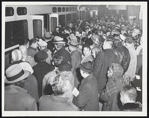 Rough Spot in the MTA picture last night was the Huntington avenue line, where stalled cars and traffic jams virtually halted service late yesterday afternoon. Here passengers battle for places at Park Street. Note harried starter at right of door.