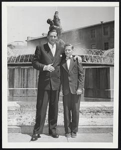 U.S. Labor Secretary in Rome. Maurice J. Tobin, U.S. Secretary of Labor and his son, Maurice Jr., are shown in front of the fountain of The Naiads, also known as The Esedra Fountain, in Rome on June 24. Tobin was received in a private audience by the Pope, Pius XII.