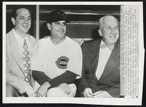Three Happy People..-- The field and office brains of the Cincinnati Reds are happy gents these days as their ball club has won 21 of its last 29 games and put on a spectacular surge from the cellar. Gabe Paul, left, vice president; Manager Luke Sewell and President Warren Giles flash their Sunday smiles as they view the situation with relish. This Photo was taken last night as the Reds beat the dodgers twice.