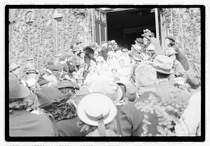 A group of children coming out of a church after their first Communion