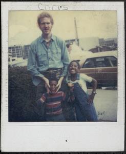Denim clad man with smiling children