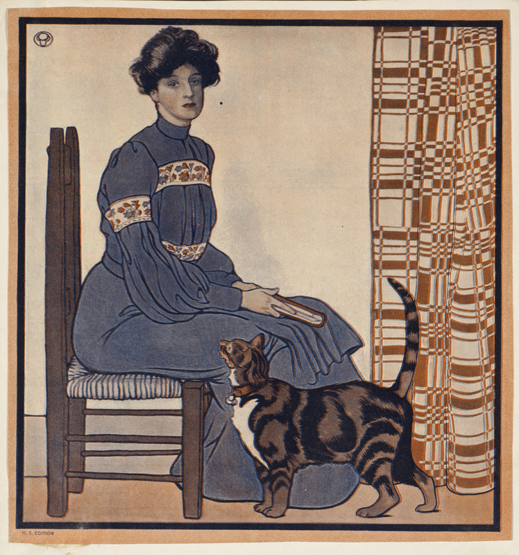Woman sitting on a chair holding a book with a cat looking on.