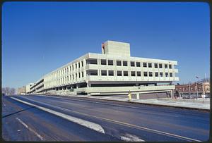 Part of series on Mass. Transit - new Quincy Rapid Transit line to Boston showing parking garage