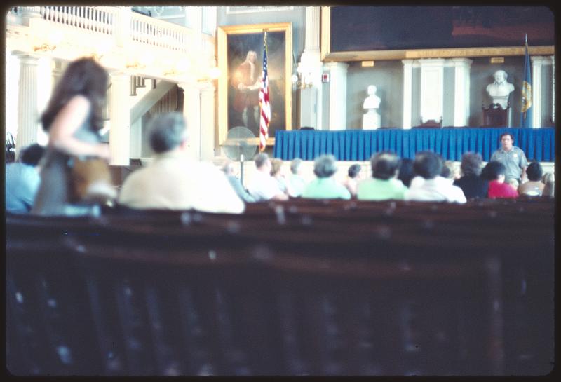 Man addressing audience in Great Hall, Faneuil Hall, Boston