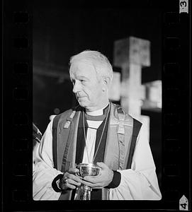 Priest holds chalice
