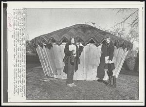 Yurt Sprouts Up In Radcliffe Yard- Radcliffe girls Elizabeth Vogdes, Philadelphia, (left) and Wendy Gray, Los Angeles pose in front of yurt that looks like a huge cupcake in the Radcliffe yard in Cambridge. The circular hut modeled after a Mongol home was built by William E. Schroeder, lecturer on Education and he plans to teach a seminar there next term.