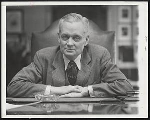 Ike's "Chief of Staff." Gov. Sherman Adams of New Hampshire at his desk in the State House, Concord, today (July 22) after announcement that he will serve as General Eisenhower's political chief of staff. Gov. Adams was a pioneer Eisenhower supporter.