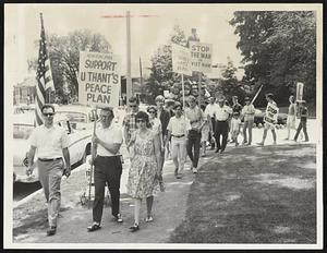 Lexington Peace March-The Minute Man statue at the Battle Green stands in the background as protester against the war in Vietnam conduct their two-hour silent march in Independence Day.