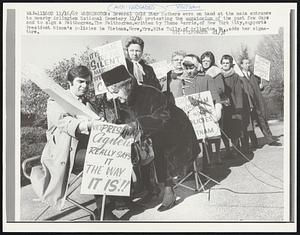 Several Gold Star Mothers were on hand at the main entrance to nearby Arlington National Cemetery 11/16 protesting the moratorium of the past few days and to sign a Faithogram. The Faithogram, written by Thano Karris, of New York City, supports President Nixon’s policies in Vietnam. Here, Mrs. Rita Tully, of Arlington, Va., adds her signature.