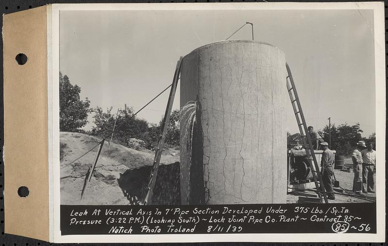 Contract No. 85, Manufacture and Delivery of Precast Concrete Steel Cylinder Pipe, Southborough, Framingham, Wayland, Natick, Weston, leak at vertical axis in 7 foot pipe section developed under 375 lbs./sq. in. pressure, 3:22 pm, looking south, Natick, Mass., Aug. 11, 1939