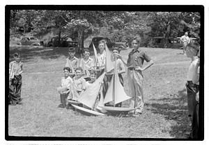 Boys posing with model sailboats