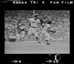 Unknown Red Sox base runner steps on first base as New York Yankees first baseman Otto Velez (#24) takes the throw while stepping on the bag