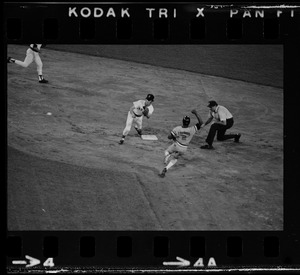Boston Red Sox 2nd baseman Doug Griffin (#2) attempts to tag sliding Baltimore Orioles base runner Rich Coggins (#2) as unknown umpire looks on