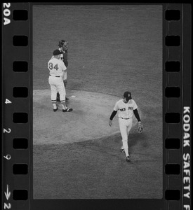 Red Sox pitcher Dennis Eckersley exits the mound in the top of the 7th inning as Red Sox manager Don Zimmer and Red Sox catcher Gary Allanson await the arrival of the new Red Sox relief pitcher