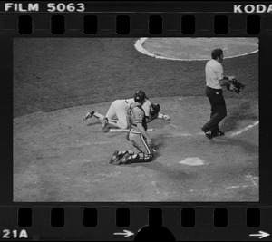 Red Sox batter Rick Burleson (#7) kneels on ground after being hit with a pitch by Texas Rangers pitcher Doc Medich in the bottom of the 7th inning as Texas Rangers catcher Jim Sundberg (#10) looks on and home plate umpire Larry McCoy steps in front of the plate