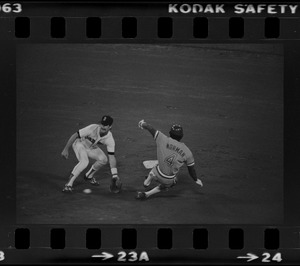 Red Sox shortstop Rick Burleson (#7) awaits the catcher's throw at 2nd base on an attempted steal by Texas Rangers Nelson Norman (#4)