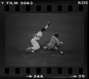 Red Sox shortstop Rick Burleson (#7) attempts a sweeping tag of Texas Rangers base runner Nelson Norman (#4) at second base