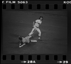 Red Sox 2nd baseman Stan Papi (#12) attempts to avoid the Texas Rangers sliding base runner Richie Zisk (#22) and complete the double play