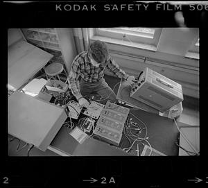 Man adjusts sound equipment
